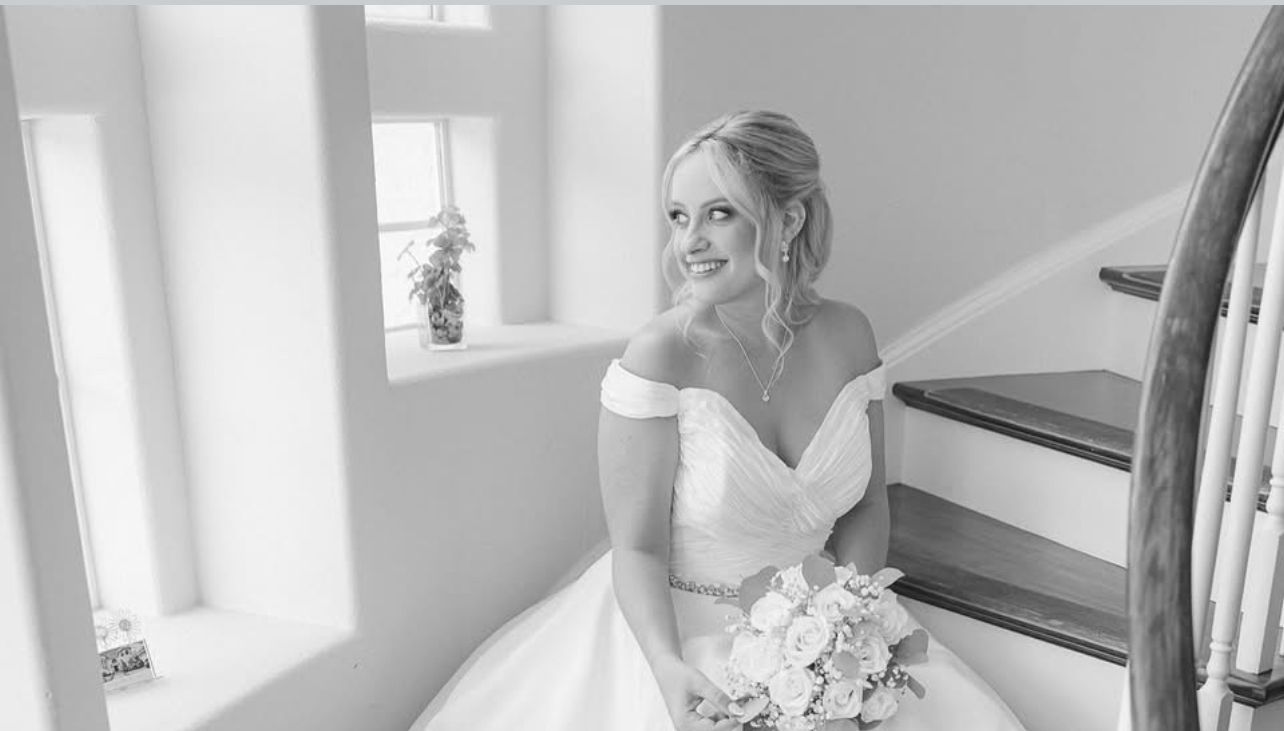 Bride in a quiet moment on the stairs