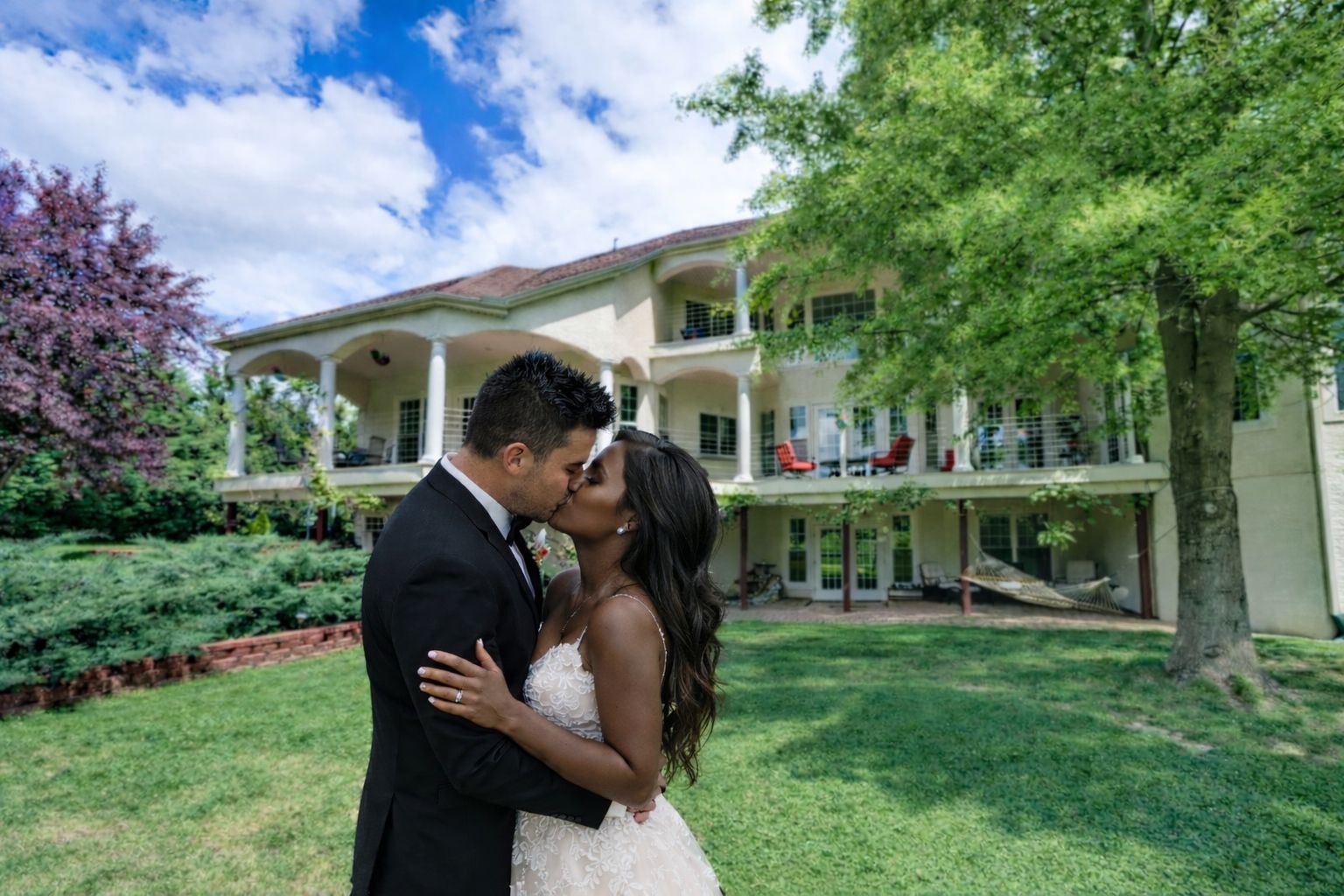 Bride and groom on the grounds at Whispering Oak